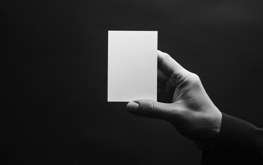 A Single Hand Holding a White Blank Card