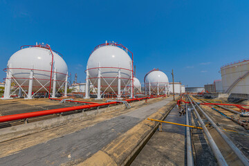 White spherical propane tanks containing