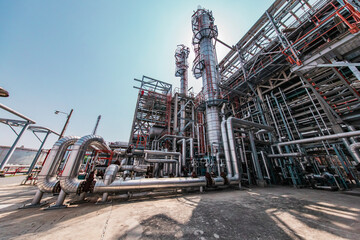 Fototapeta premium Oil​ refinery​ and​ plant and tower column of Petrochemistry industry Refinery plant equipment for pump pipeline oil and gas valves