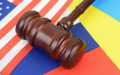 Judge gavel on USA, Russian and Ukranian flags close up. Negotiantion between Russia, United States...