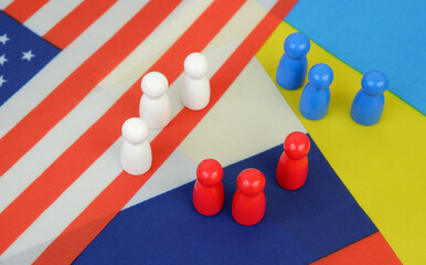United States, Russian and Ukranian flags and different people figures. Negotiations and relationship between USA, Russia and Ukraine.