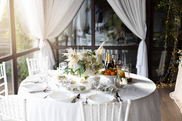 beautiful set of plates with kitchen utensils with food on white tablecloth