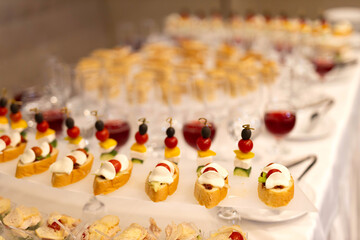 banquet table with delicious snacks at the event