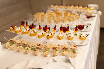 banquet table with delicious snacks at the event