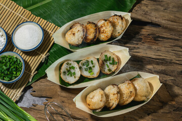 Khanom Krok is an ancient Thai dessert made from flour, sugar and coconut milk