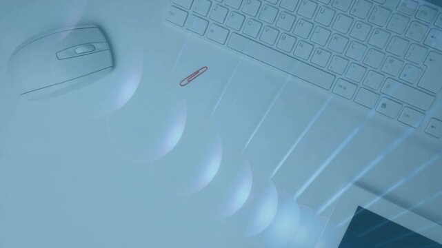 Abstract light patterns overlaying computer mouse and keyboard in animation design