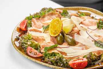 Salmon carpaccio, salad salmon appetizer served on a plate, copy space, top view