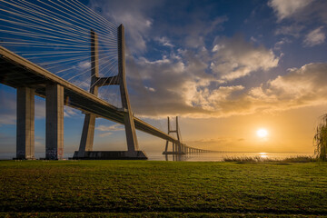 Sunrise in Vasco da Gama bridge in Lisbon Portugal