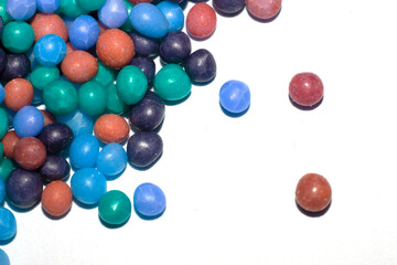 Close up of round ball sugar ice cream cake decorations on a white background
