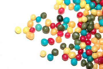 Close up of round ball sugar ice cream cake decorations on a white background