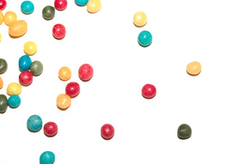 Close up of round ball sugar ice cream cake decorations on a white background