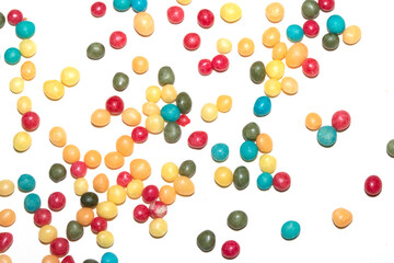 Close up of round ball sugar ice cream cake decorations on a white background