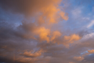 Beautiful warm clouds on the sunset sky.