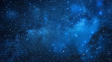Fototapeta premium Blue night sky filled with stars, depicting a serene and expansive space suitable for screensavers and astrology-themed designs.