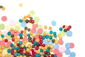 Close up of sprinkles sugar balls and chocolate cake ice cream decoration strands on white background
