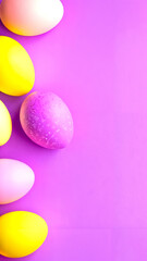 A group of colorful easter eggs on a purple background