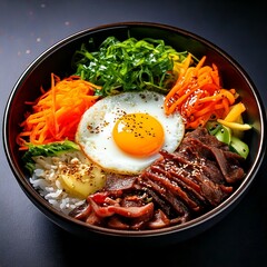 여러 색깔들의 먹음직한 나물들과 계란 노른자가 놓인 비빕밥