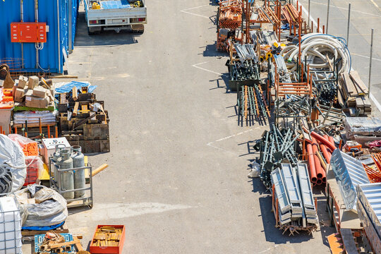 Looking down on construction yard stacked with building materials