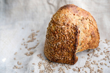 Sourdough Multigrain Bread. Sunflower seeds sourdough bread on a hemp coarse cloth. Copy space. 