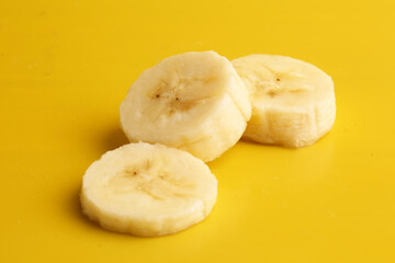 sliced ​​bananas on yellow background