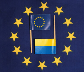 flag of ukraine and eu against the background of the eu flag.concepts of the sponsor of ukraine eu
