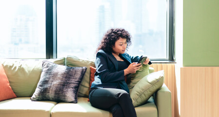 Fototapeta premium Businessperson Video Calling on Smartphone in Modern Office