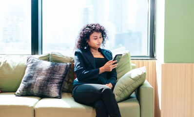 Businessperson Video Calling on Smartphone in Modern Office