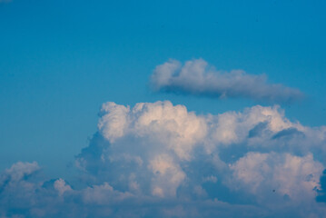 Blue sky fluffy white clouds on summer season bright clear skyline with beautiful cloudscape. Panorama blue sky clouds pattern on daylight with copy space. Cumulus cloudscape air climate sunny day