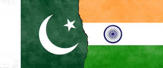 pakistan and indian flag separated by white crack line. concept of geopolitical and economic relations between pakistan and india