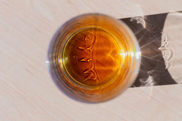 Whiskey in a glass top view, close-up