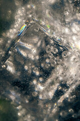 alcoholic drink with ice and tonic, macro, abstract background