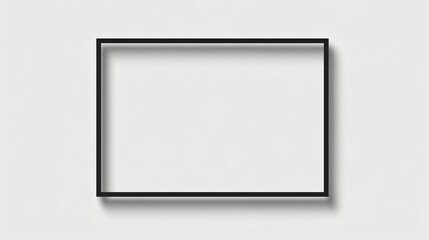Empty black picture frame on white wall for artwork or poster.
