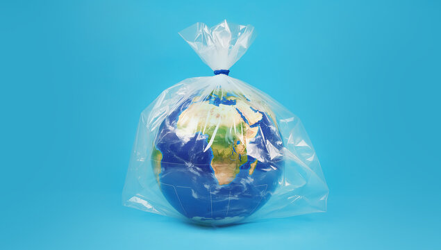 Earth Wrapped in Plastic &ndash; Symbol of Environmental Pollution and Climate Crisis, earth in plastic bag
