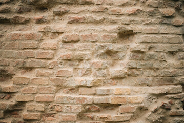 Old brick wall. Cracked and scratched texture. Grunge background