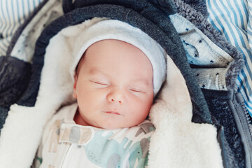 Newborn baby sleep first days of life. Two week old baby sleeping.