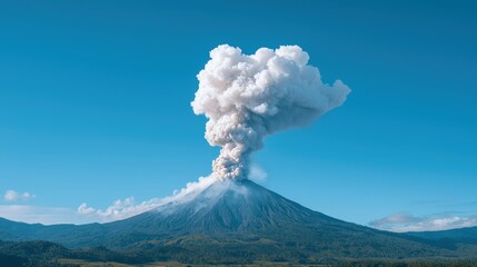 Volcanic eruption plume against a clear blue sky.