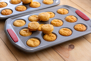 Muffins in a tray fresh from the oven.