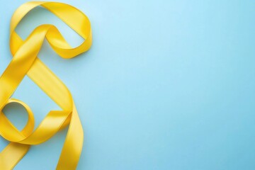 soft yellow ribbon on light blue background, perfect for design.