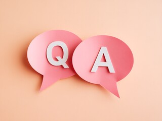 Colorful Q&A speech bubbles on a soft peach background, inviting engagement and discussion.