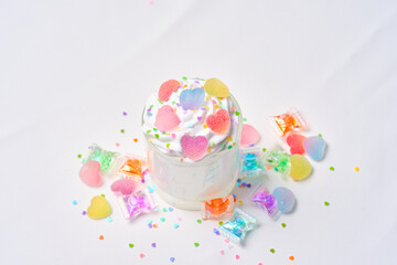 A cup of fresh cream with jelly candy