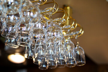 A collection of wine glasses elegantly hanging from a stylish rack