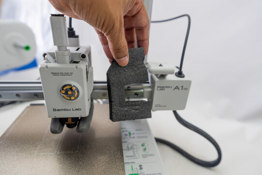 Suzano, Sao Paulo - Brazil - january 23, 2025: Unboxing the A1 Mini 3D printer with AMS module piece by piece