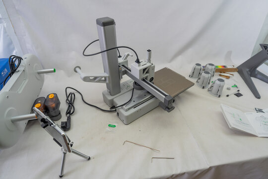 Suzano, Sao Paulo - Brazil - january 23, 2025: Unboxing the A1 Mini 3D printer with AMS module piece by piece