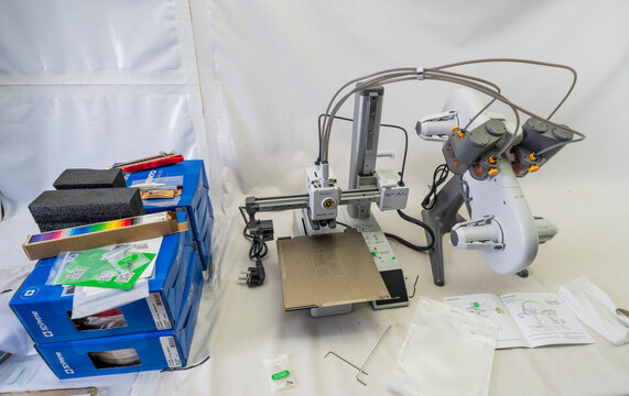 Suzano, Sao Paulo - Brazil - january 23, 2025: Unboxing the A1 Mini 3D printer with AMS module piece by piece