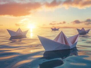 Obraz premium White paper boats drift gracefully on the ocean at sunrise, capturing a tranquil moment of serenity and hope