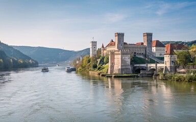 Naklejka premium Danube River, Riverfront castle, scenic autumn view
