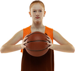 Portrait of confident red-haired teen girl, basketball player posing with basketball ball isolated...