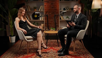 Two experts talking in a cozy, loft-style podcast studio
