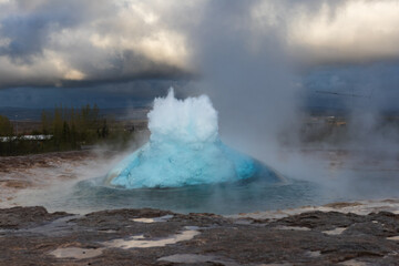 Iceland – Geysir Erupting at Dusk: A Majestic Display of Nature's Power