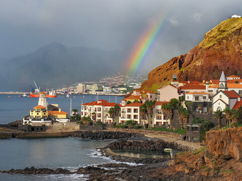 Stormy and rainy day in the Cani&ccedil;al, island of Madeira, Portugal. Beautiful Portuguese landscape. Coast of Atlantic ocean. Dark clouds with rainbow.